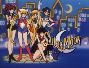 The opening panel of the English dub of Sailor Moon. from DiC featuring the five Inner Senshi superimposed on a poorly drawn city night scene with the DiC logo of the words 'Sailor Moon' over a crescent moon image.