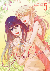 A blonde with long hair in an orange dress and a long dark-haired woman wearing a beige top embrace happily.