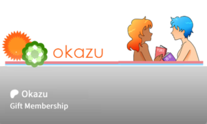 A "gift card" facsimile of the Okazu Patreon logo, featuring two women - one with short blue hair and pale skin and the other with shoulder length orange ombre hair, reading books that say in Japanese and English "Yuri'. 