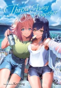 A woman with pinkish collar length hair wearing denim shorts and a green tee shirt, holds up a can of beer, while next to her a woman with long black hair, wearing running shorts and a white tank top sucks on an ice pop, as she takes their selfie in front of a deeply blue ocean.