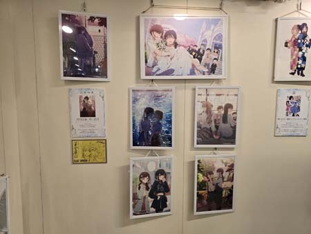 Images of Yuri manga on the wall. Osaka Yuriten 2025, Bea Baker