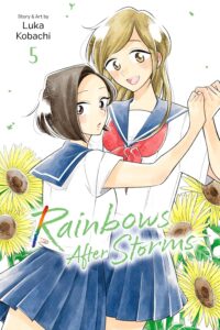 Two girls in white school blouses with blue sailor style collars and blue shirts stand as if dancing, the tall blonde smiles at us, while the shorter dark haired girl looks at us startled. They are surrounded by sunflowers.
