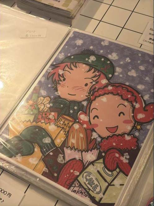 A print image of Rica and Miho in the snow with a grocery bag.